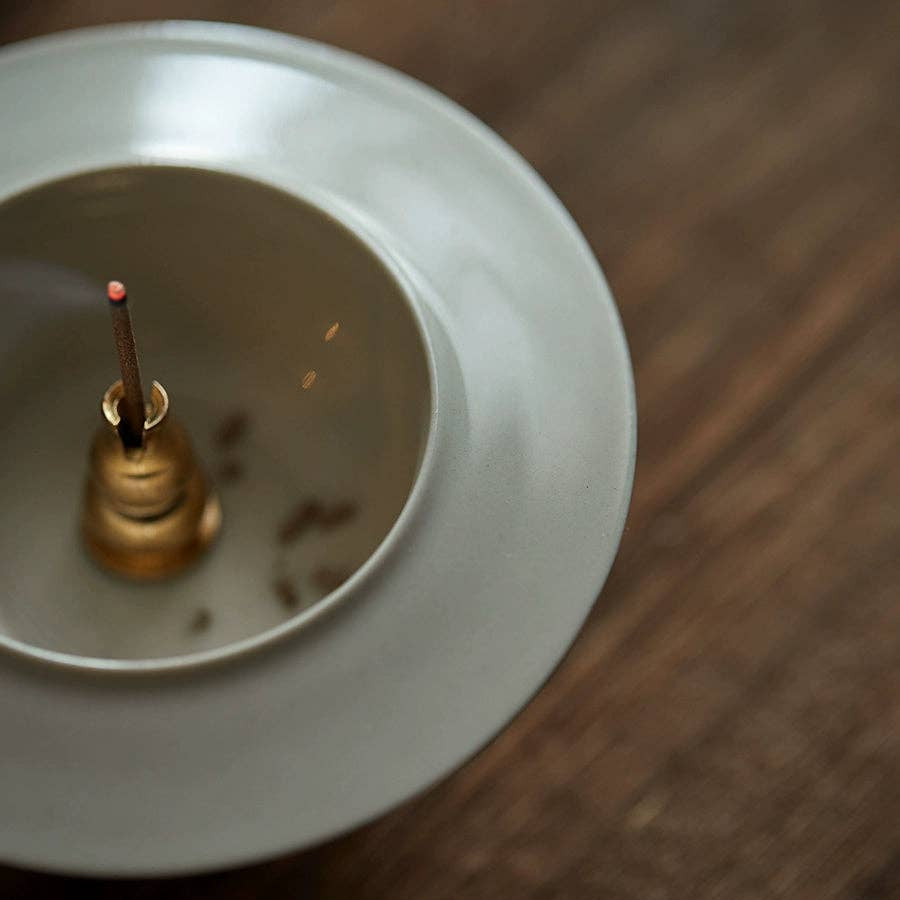 Close-up of a light bulb socket on a wooden surface